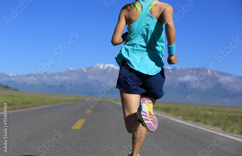 healthy lifestyle young woman runner running on trail