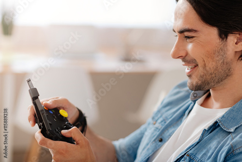 Cheerful man playing video games
