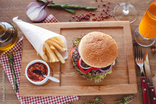 burger wooden board tablewear potato photo