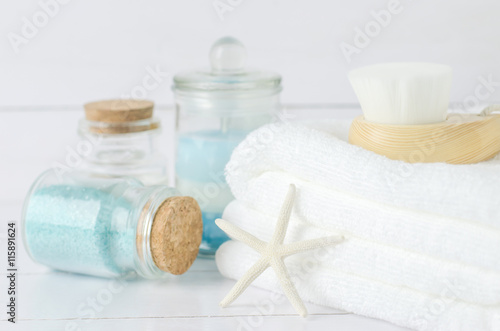 White towel with Facial cleansing brush and spa tools