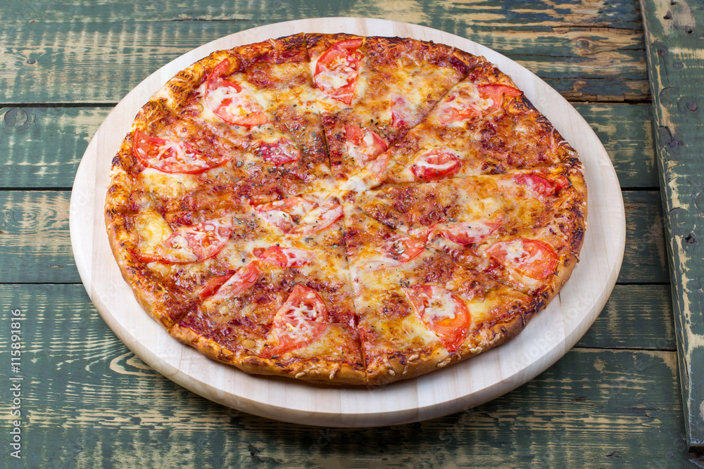 Delicious sliced margarita pizza on a table.