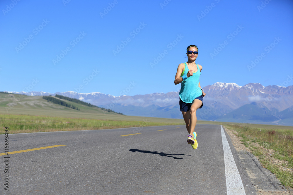 healthy lifestyle young fitness woman runner running on road