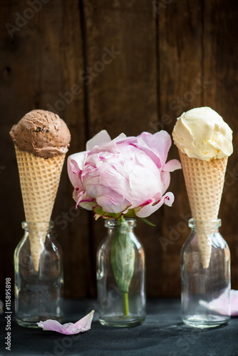 Chocolate and Vanilla Ice Cream Scoops in Waffle Cones