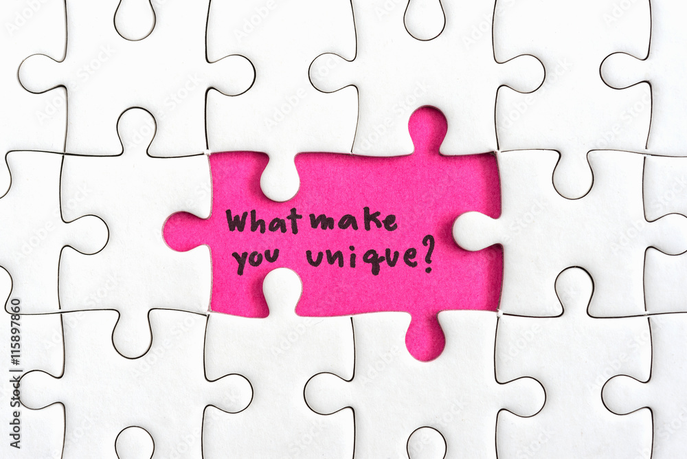Jigsaw puzzle piece with two missing and hand writing letters word what  make you unique and question mark Quotes business concept Stock Photo |  Adobe Stock
