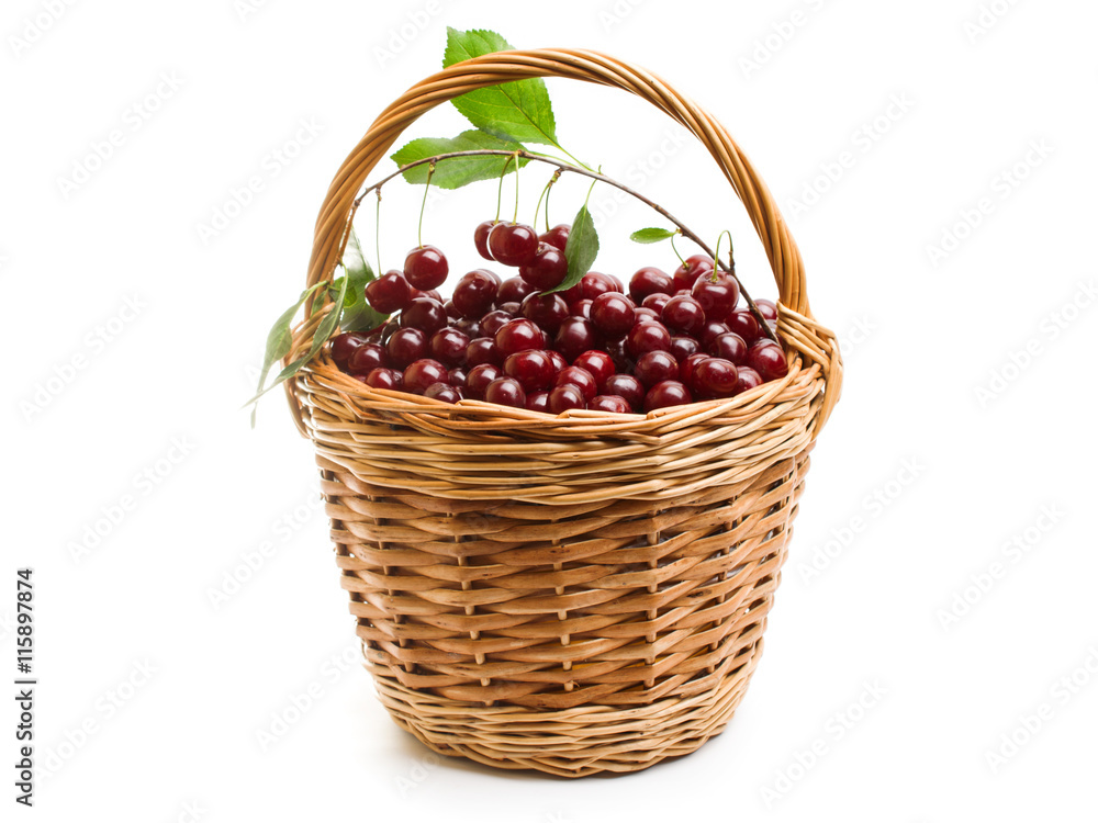 Basket full of fresh red cherry on a white background Basket full of fresh red cherry on a white background