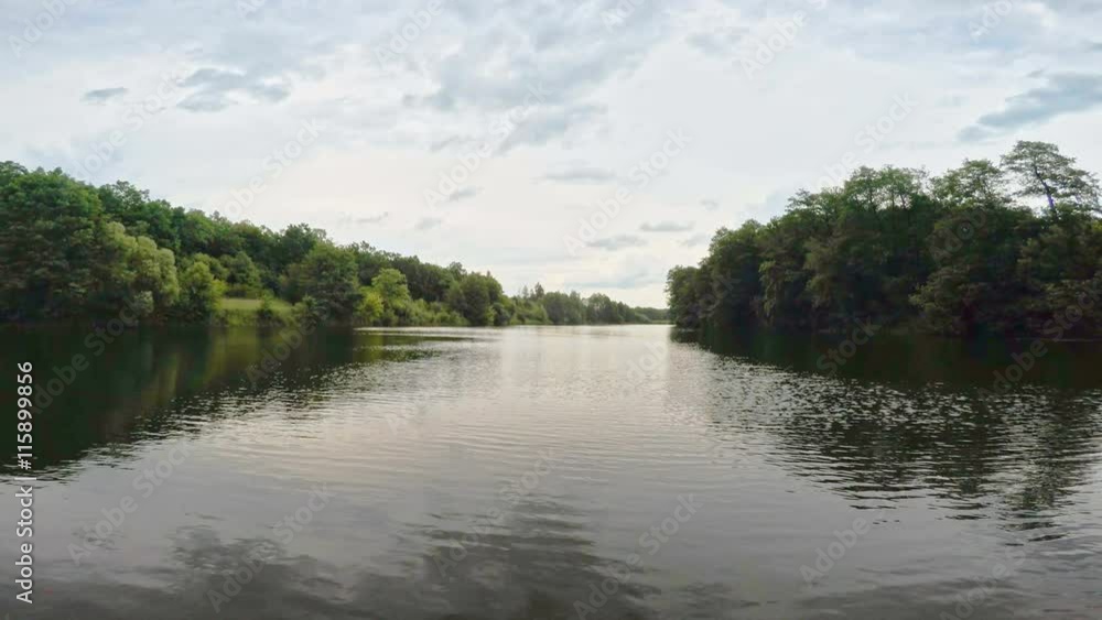 Summer river with bright blue sky and clouds. Wide angle. Summer river with bright blue sky and clouds. Wide angle.