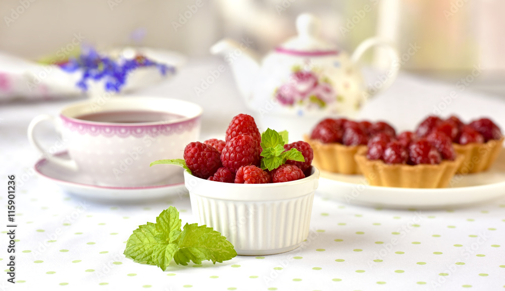 raspberries fuits in a bowl on a table raspberries fuits in a bowl on a table
