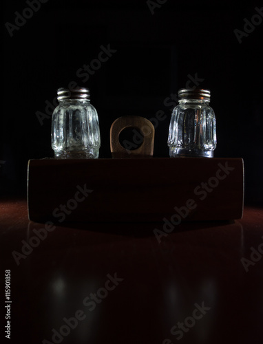 Empty salt bottles on wooden holder