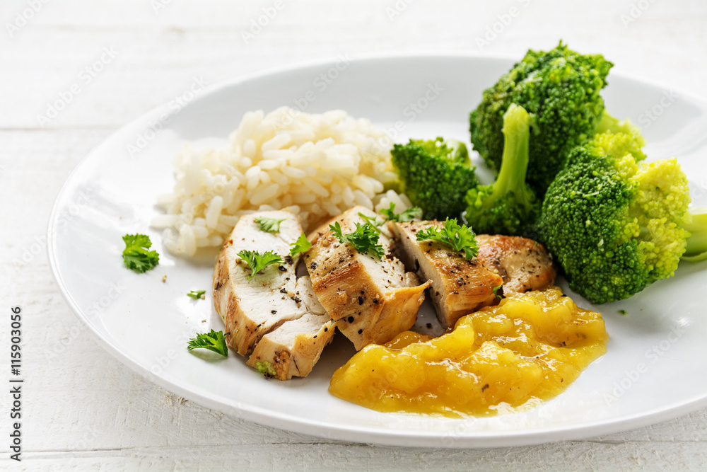 fried chicken breast fillet with fruity mango sauce, broccoli and rice fried chicken breast fillet with fruity mango sauce, broccoli and rice