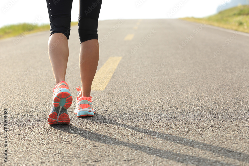 young fitness woman runner legs running on road young fitness woman runner legs running on road