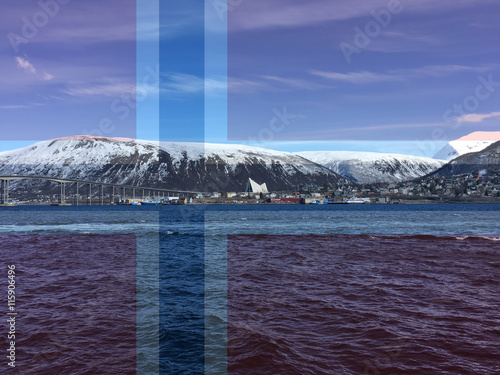 The city of Tromso in Northern Norway. Covered with the Norwegian flag.