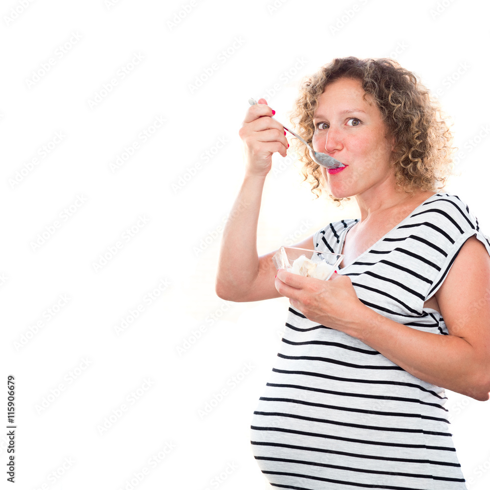 Happy pregnant woman eating and enjoying ice cream Happy pregnant woman eating and enjoying ice cream