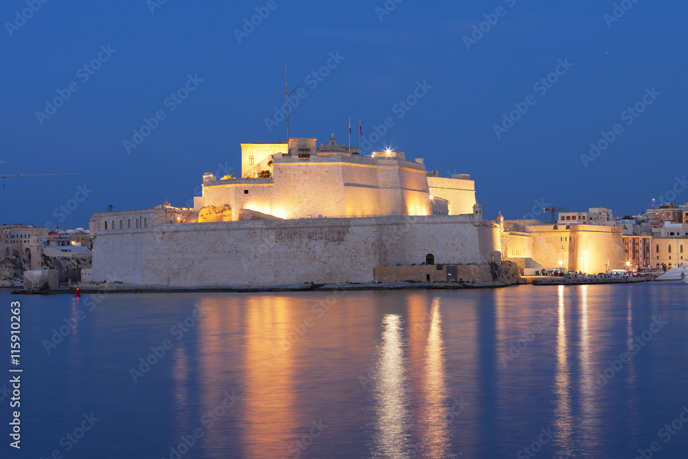 The fortified city walls of Malta at sunset 