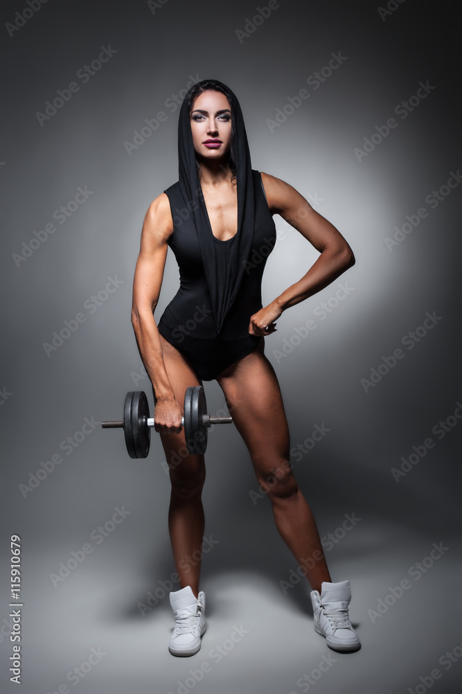 studio shot of perfect body of bodybuilder female; studio shot of perfect body of bodybuilder female;