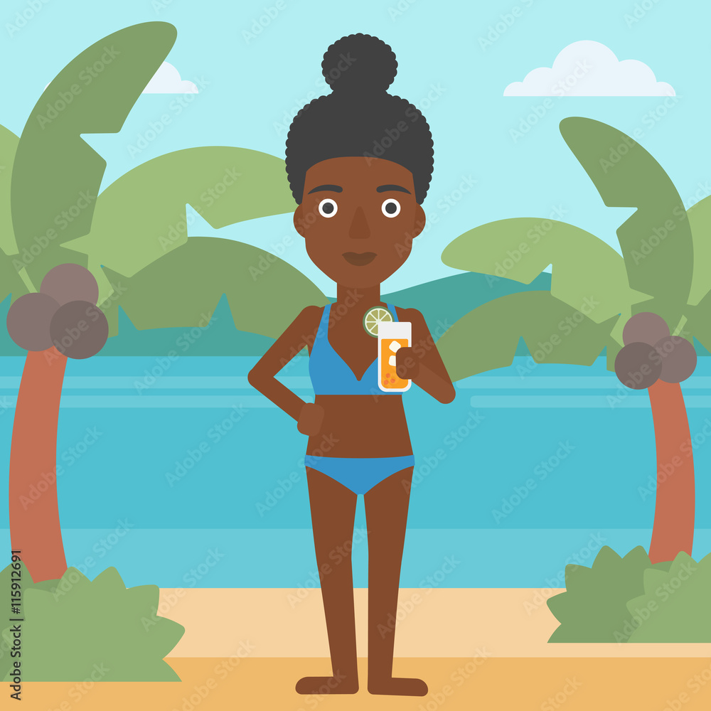 Woman with cocktail on the beach.