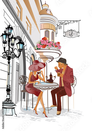 Man and woman sitting and drinking coffee in a street cafe. 