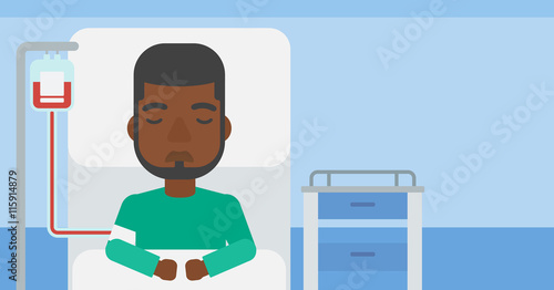 Patient lying in hospital bed.