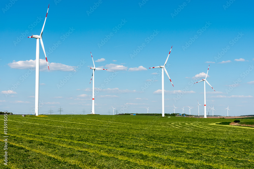 Windwheels in the fields seen in rural Germany Windwheels in the fields seen in rural Germany