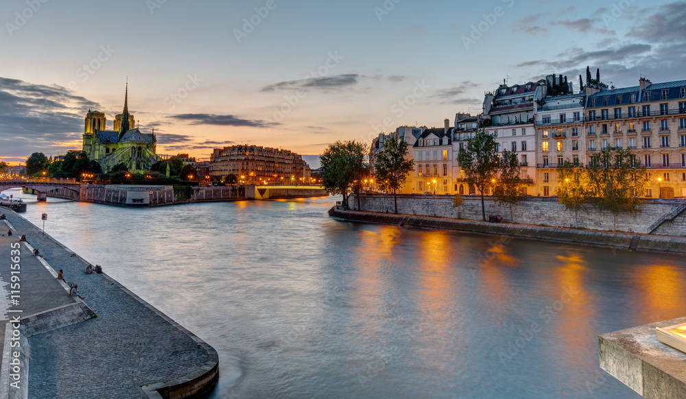 Beautiful evening in Paris with the Notre Dame Cathedral and the Ile de la Cite in the back
