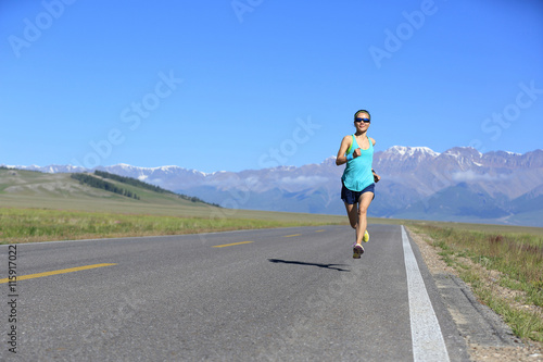 healthy lifestyle young fitness woman runner running on road