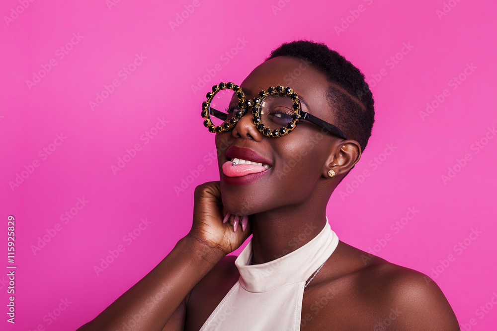 Funny african girl with tongue stuck out wearing strange glasses Stock  Photo | Adobe Stock