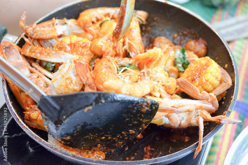 Fried shrimp ,squid and crab with basil with hot and spicy sour, Fried shrimp ,squid and crab with basil with hot and spicy sour,