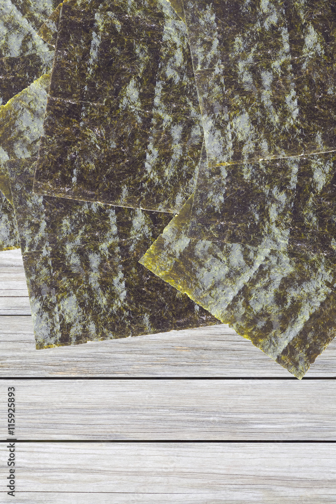 Nori , Japanese edible seaweed used as a wrap for sushi and onigiri