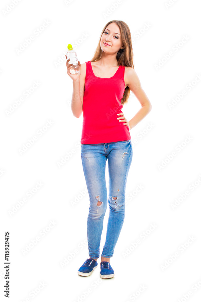 Young attractive woman in blue jeans isolated on white background. Beautiful girl model posing in the studio. Young attractive woman in blue jeans isolated on white background. Beautiful girl model posing in the studio.