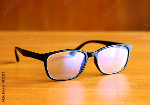 the glasses on wooden background
