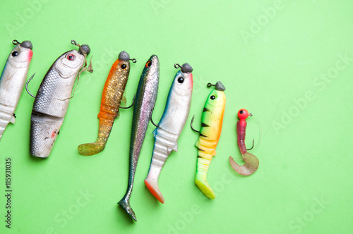 Artificial fish, fishing equipment on a green background