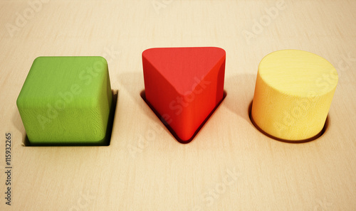 Foto Cube, prism and cylinder wooden blocks inside holes
