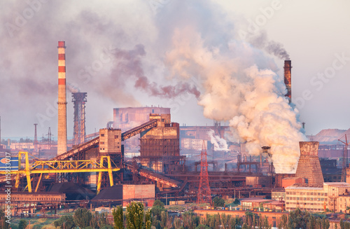 Wallpaper Mural Industrial landscape in Ukraine. Steel factory at sunset. Pipes with smoke. Metallurgical plant. steelworks, iron works. Heavy industry in Europe. Air pollution from smokestacks, ecology problems. Torontodigital.ca