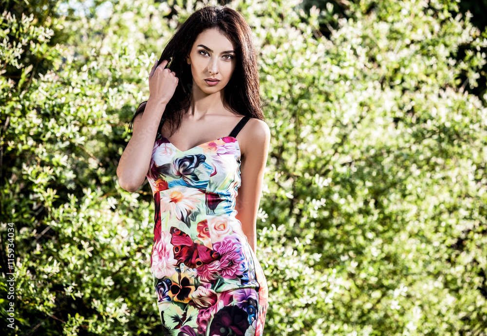 Fototapeta premium Outdoors portrait of beautiful young brunette woman.