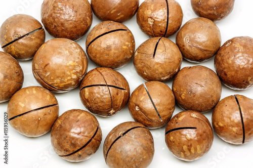 macadamia nuts on white background. © supaleka