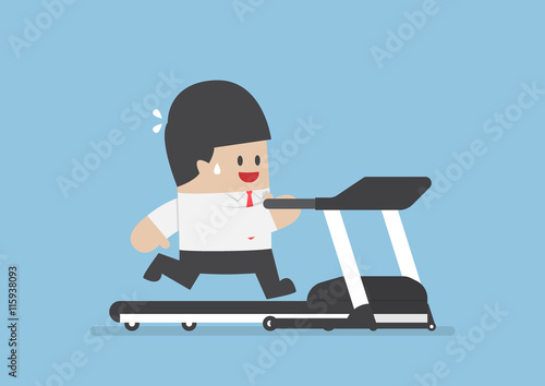 Businessman running on treadmill