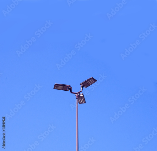 LED Energy Savings Lighting on Blue Sky Background