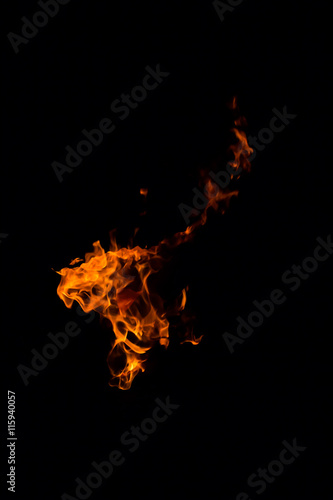 Fire flames on a black background © hideto111