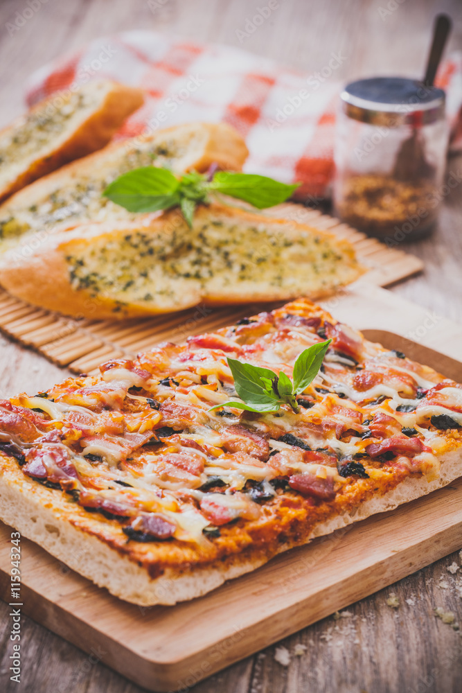 Homemade bacon pizza with garlic bread Homemade bacon pizza with garlic bread