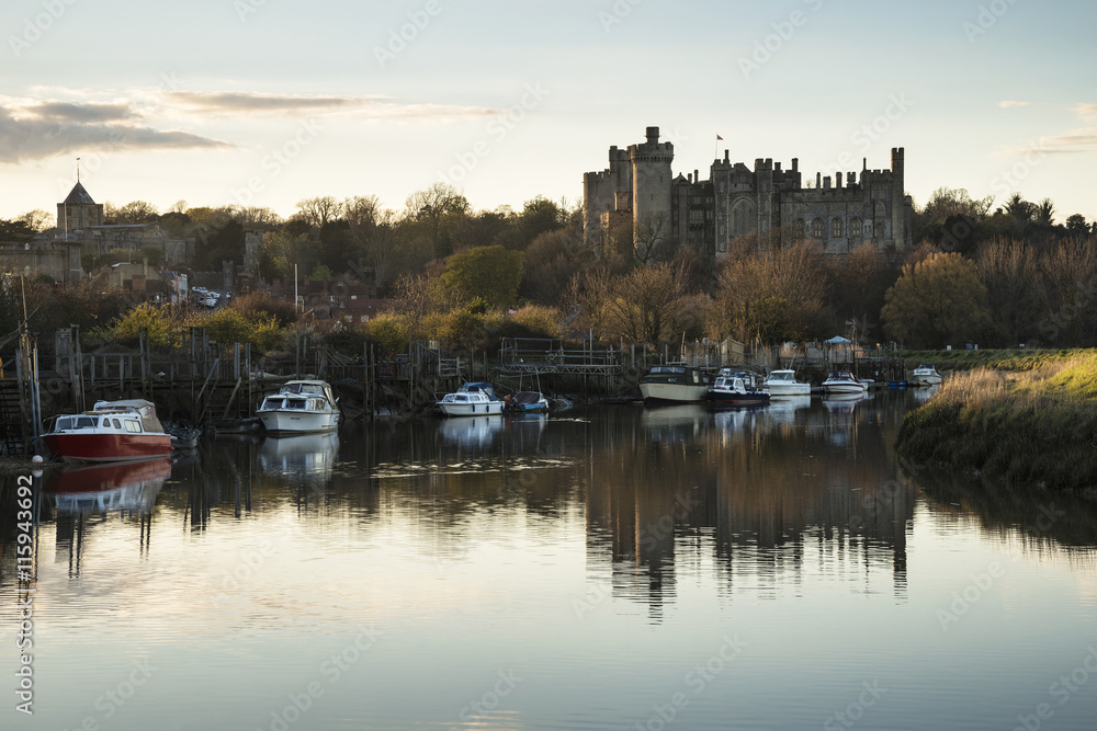 Landscape image of old medieval Castle viewed across River at su
