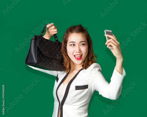 Εκτύπωση καμβά lady show off her new purse by mobile phone