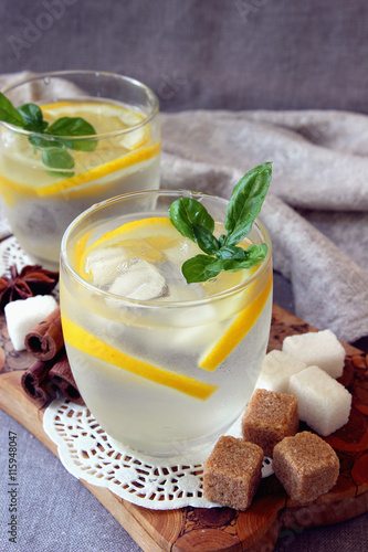 Glasses with cold lemonade and ice cubes..