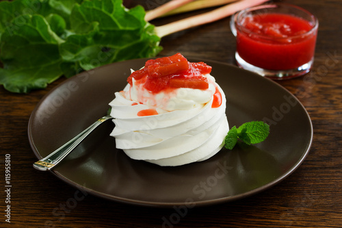 Dessert of meringue with rhubarb and mint sauce.