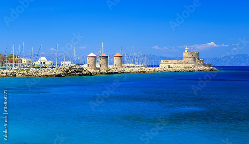 Windmills in Mandraki Harbour. Rhodes, Greece, Europe