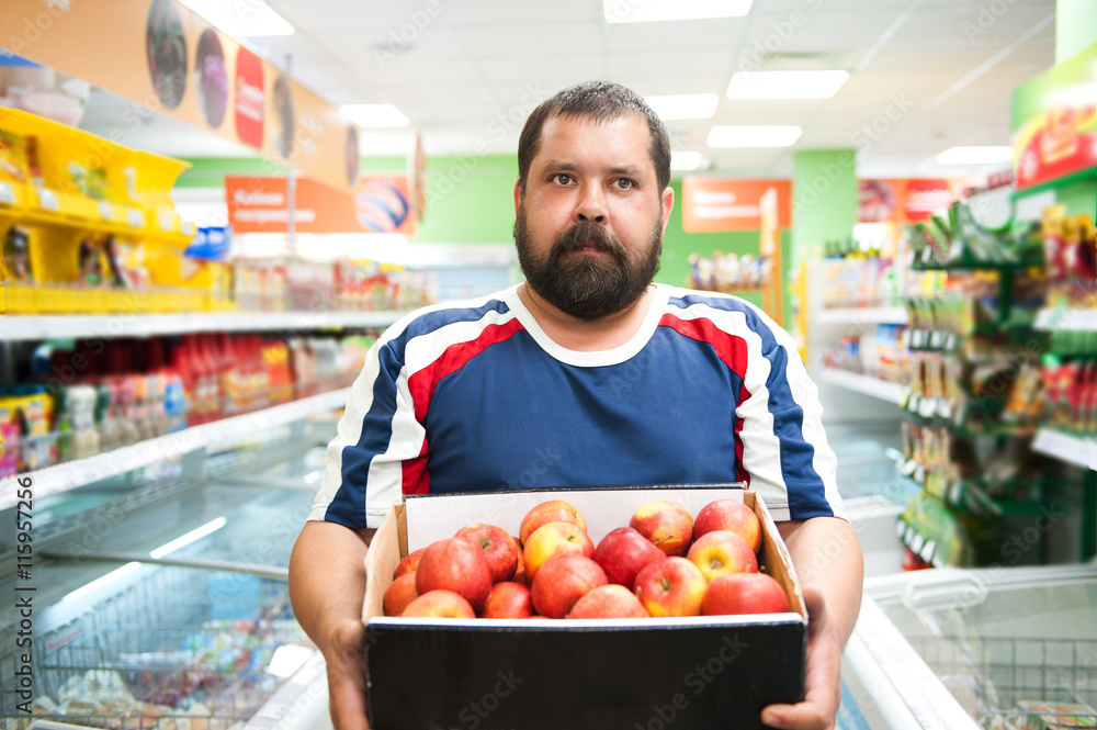 The man in the store bought apples 