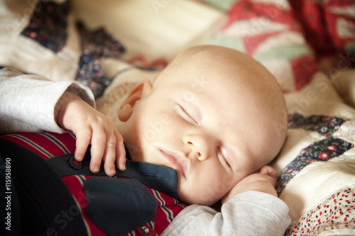 Sleeping Baby on a patchwork blanket