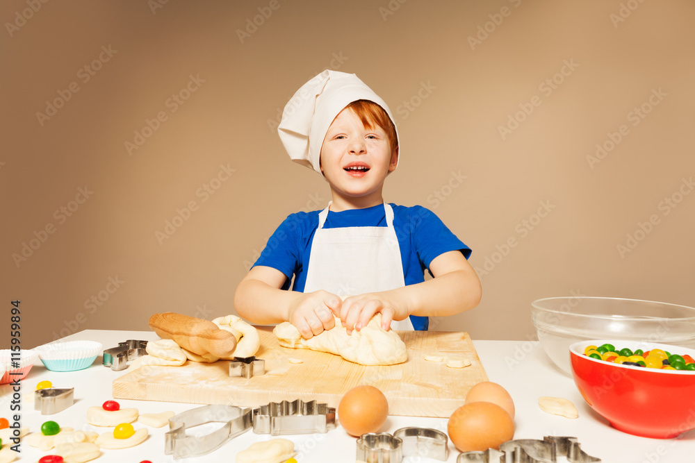Cute baker kneading dough for candy filled cookies Cute baker kneading dough for candy filled cookies