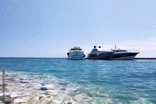 luxury boats on the beach © amedeoemaja