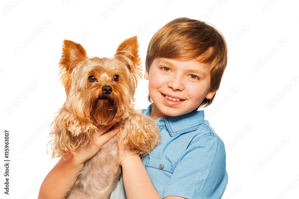Smiling boy holding Yorkshire terrier Smiling boy holding Yorkshire terrier