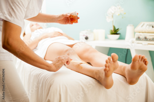 Hair removal with honey at a spa