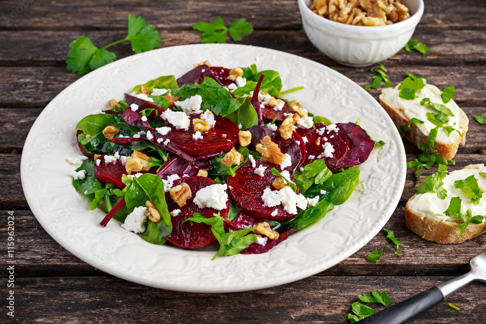 Healthy Beet Salad with fresh sweet baby spinach, kale lettuce, nuts, feta cheese and toast melted Healthy Beet Salad with fresh sweet baby spinach, kale lettuce, nuts, feta cheese and toast melted